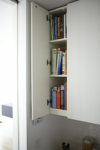 A narrow end cabinet, located above a prep area and near my cook top, is the perfect spot for my cookbook collection. A bookstand lets me to prop open a cookbook and follow the recipe as I cook. A narrow end cabinet, located above a prep area and near my cook top, is the perfect spot for my cookbook collection. A bookstand lets me to prop open a cookbook and follow the recipe as I cook.