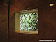 Insulated leaded beveled diamond window in a shower.