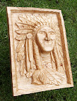 Indiaan 
Materiaal: lindehout
Behandeling: lijnolie en bijenwas
Afmeting: 27x37x7cm
Achtergrondinformatie: In Italië zag ik een machinaal vervaardigde indianenkop en toen wilde ik mijn eigen handgemaakte versie maken, en wel vanaf een foto.