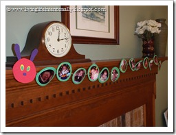 Decorations: Hungry Caterpillar with pictures of 1st year on mantel