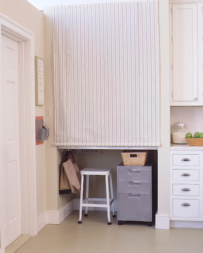A roll down shade makes it easy to hide a workspace in an alcove.