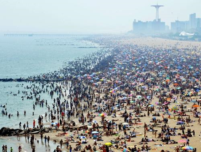 Thousands flock to the beach in Coney Island during a heat wave, 11 June 2011. Photo: NY Post