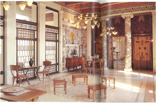 Summery tones of wood and leather perfectly compliments the cool columns and yellow and white marble panels covering the walls.