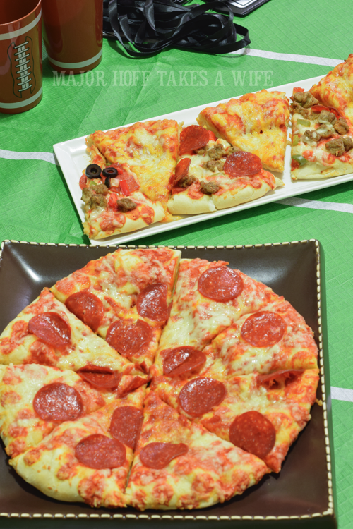 DiGiorno pepperoni stuffed crust pizza as game fuel. Looking for a fun party for your teenage boy? Why not throw a Football video game party? Easy ideas for how to entertain kiddos during the Big Game. Features DiGiorno pizza, personalized football cups, free printable lanyards, and an incredible recipe for football shaped ice cream sandwiches! #GameTimeMVP #CollectiveBias #ad Lanyards make for a fun swag idea for a party. Looking for a fun party for your teenage boy? Why not throw a Football video game party? Easy ideas for how to entertain kiddos during the Big Game. Features DiGiorno pizza, personalized football cups, free printable lanyards, and an incredible recipe for football shaped ice cream sandwiches! #GameTimeMVP #CollectiveBias #ad