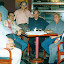 Foto tirada em 10 de março de 2000, no CREA, por ocasião do lançamento do livro Aspectos Contemporâneos da Física. Da esquerda para a direita: João Sobrinho, João dos Santos Messias Filho, Geraldo Mártires Coelho, Bassalo, Eduardo Boulhosa Nassar, Antonio Pinho e Manoel Leite Carneiro.