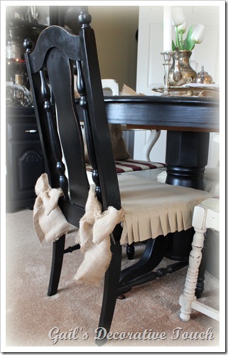 I made chair slip covers for the black chairs and added burlap bows