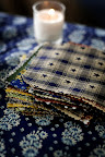 Taryn found tablecloths at Pottery Barn, which she trimmed down to make into runners and napkins. Taryn found tablecloths at Pottery Barn, which she trimmed down to make into runners and napkins.
