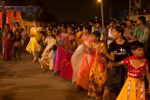 3. Guests are usually eagerly welcomed into to festivals, such as this Navratri festival I joined near a Mumbai slum with my friend Vikas Khanna.