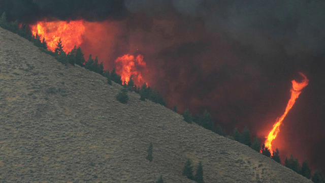 A fire whirl highlights the eratic wind conditions from the 64,000 acre Beaver Creek Fire on Friday, 16 August 2013 north of Hailey, Idaho. A number of residential neighborhoods have been evacuated because of the blaze. Photo: Ashley Smith / Times-News