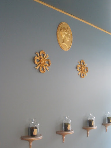 I love the blue of this room mixed with the beautiful gold medallions.