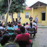 Pat telling the parents about school policies.