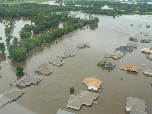 The Souris River floods Minot, North Dakota, on 26 June 2011. Minot residents evacuated as the historic rise in the Souris River approached. minotdailynews.com