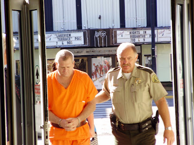 Steven Dean McGinnis escorted into Marion County Courthouse by Sheriff Ron Goemaat during pre-trial hearing