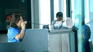 Leaving at the airport with 3rd world pa system...megaphone strapped to desk in very new and modern (looking) Gautamala City airport. As garbled as a subway announcement. Photos by TOM HART
