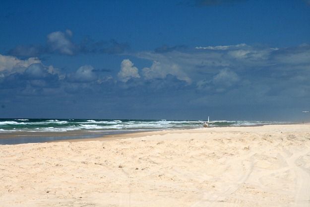 Plane landing on beach Fraser Island Australia.png