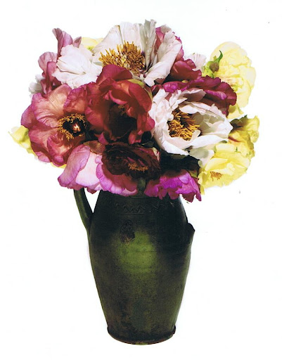Bronson believes that the container is as important as the flowers. Here, he uses an antique stoneware pitcher as a vase. Bronson believes that the container is as important as the flowers. Here, he uses an antique stoneware pitcher as a vase.