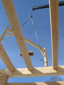The gable bent of the purlinn system is flown into place.