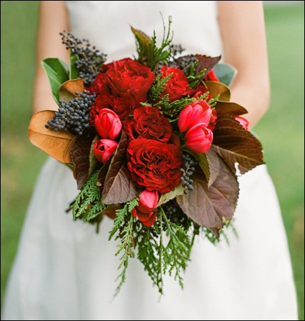 blue privet berry, red cabbage roses, red tulips, arborvitae from the garden and magnolia holly chapple and anne robert photo