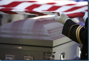 flag draped  over casket