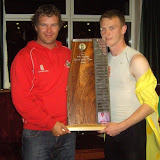 Ben Byram receives the Mike Brennan Spirit of the Team trophy from Queenslander Tim Lyne