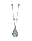Erica Courtney's platinum and aqua necklace would perfectly decorate the bodice of a simple sheath.