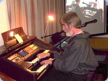 Richard playing the Club's Technics GA3 organ