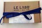 This box balances a vintage-like stamped typeface with bold, bright-blue ribbon. It is great inspiration for a favors packaging.