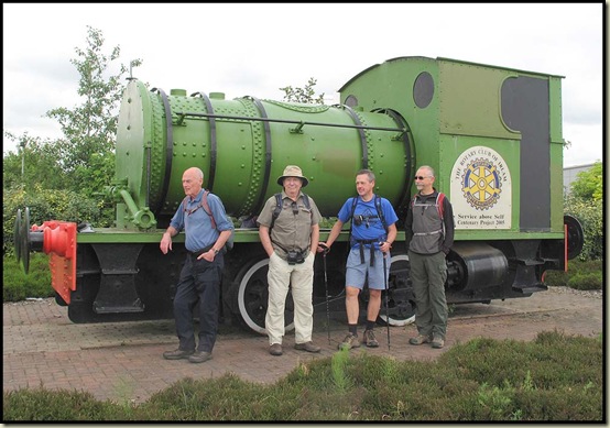 Roy Bullock joins Alan, JJ and Rick, to pose outside an old shunting engine