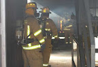 Chief Wyatt inspecting the burn prior to trainees entering the building