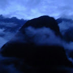 The mountainous could forest of the Sacred Valley, Peru in an erie blue light of dawn.