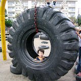 Kai in the biggest tire at the park