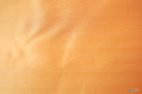 Tkanina ognioodporna typu "tafta". Na zasłony, poduszki, narzuty, dekoracje. Pomarańczowa, brzoskwiniowa.