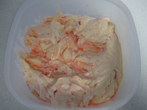 The finished ice cream is so pretty—pale pink with swirls.