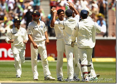 Umesh Yadav of India celebrates bowling Shaun Marsh of Australia with teammates during day three of the First Test match