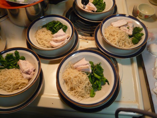 More soup: chicken, Chinese broccoli, egg noodles awaiting broth, poached eggs and sriracha