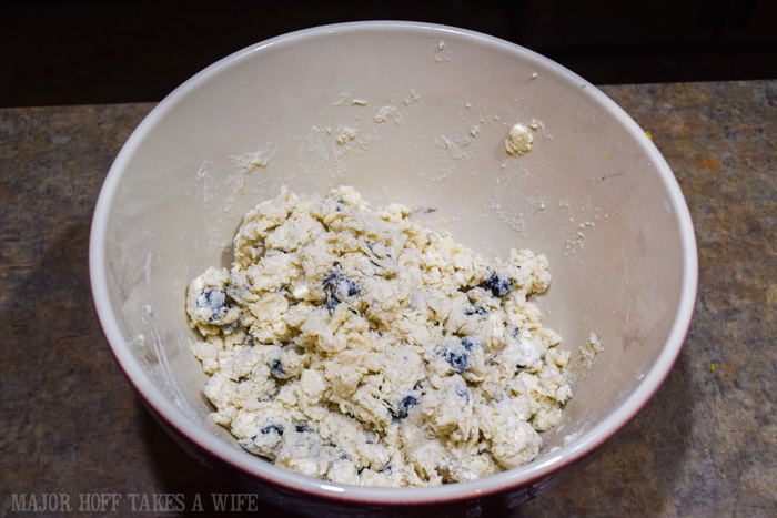 Blueberry Scone mix. A melt in your mouth recipe for blueberry scones. Inspired by Starbucks in house version, this blueberry scone with hints of lemon and a crunchy sugary top will delight everyone. Serve during High Tea, or just as a mid afternoon snack. Perfect along side tea or coffee, or as a stand alone blueberry dessert. You won't believe how easy these are to make! Never made scones before? Never fear, this includes a step by step tutorial on how to make scones. #HighTea #blueberries #Starbucks #scones #dessert Blueberry Scone mix