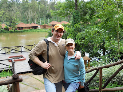 On the deck of the Peppercorn restaurant. That is our villa behind us over the lake.