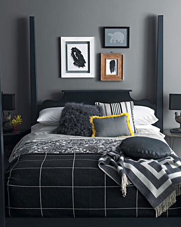 Layer on blacks and grays. We've mixed plaid and floral prints -- and shaggy pillows and plush throws -- on this black four-poster. Dark artwork and lamps carry the color scheme throughout the room, while a single shot of color -- the yellow-trimmed pillow -- keeps it lively. Layer on blacks and grays. We've mixed plaid and floral prints -- and shaggy pillows and plush throws -- on this black four-poster. Dark artwork and lamps carry the color scheme throughout the room, while a single shot of color -- the yellow-trimmed pillow -- keeps it lively.