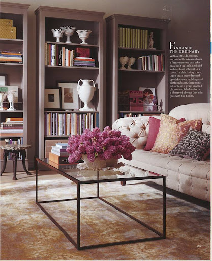 I love these three stand-alone cabinets with crown molding. A warm shade of gray paint helps them blend into the space, giving them a built-in look that allows a collection of antique urns and photos stand out among the books. I love these three stand-alone cabinets with crown molding. A warm shade of gray paint helps them blend into the space, giving them a built-in look that allows a collection of antique urns and photos stand out among the books.