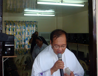 Msgr. Cenovio Lumanog blesses the new CTED computer lab.