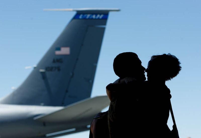 Mickaela Hawkley embraces her husband Bleu as the soldiers from the Utah Army National Guard's Second Battalion, 211th Aviation unit returned from a 12-month deployment to Afghanistan.