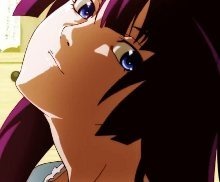 Hitagi, chin up and back-lit, looks down and to the side at the viewer with a very slightly playful yet confident face