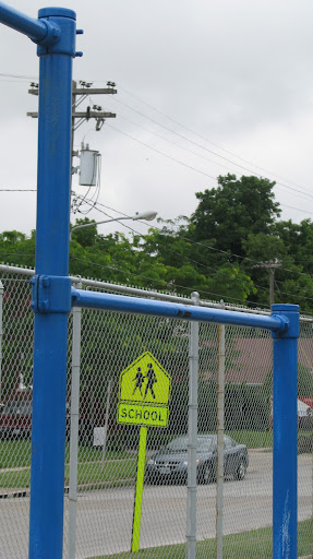 Crosswalk signs are a vital part of the Schools public safety plan reminding drivers to slow down around Schools. (Photo by: Kenrick Nobles)
