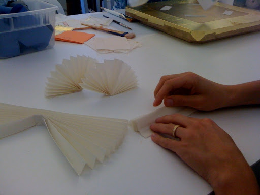 Here we're making mini pleated items to include in the opening shot.