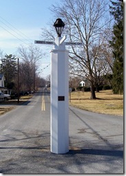 White Post column at center of town, plaque seen on column