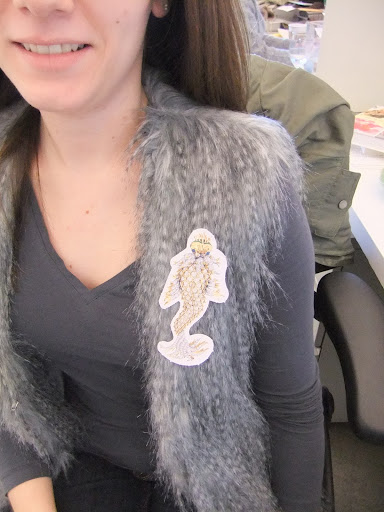 Kristen Flanagan, assistant editor at Martha Stewart Living, shows off an aquatic brooch.