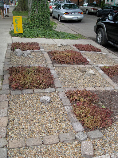 Gardening on the easement doesn't necessarily mean increasing your work load - this creative solution looks better than grass and doesn't take much regular maintenance at all.