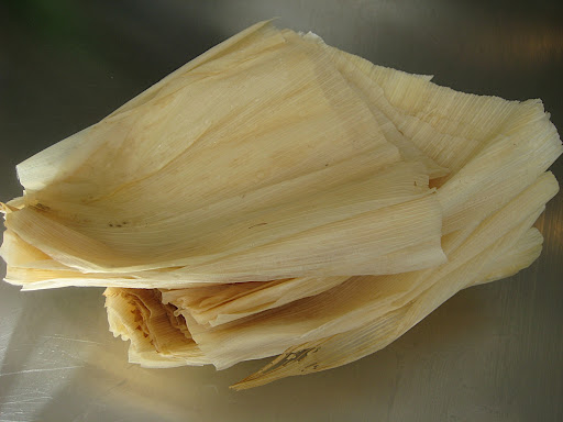 The husks must be soaked overnight in cool water to make them pliable and to keep the dough from sticking to them.