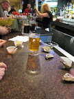 It was a perfect late lunch: plastic mugs of beer, oysters plopped right on the counter, and a setup to make your own cocktail sauce.