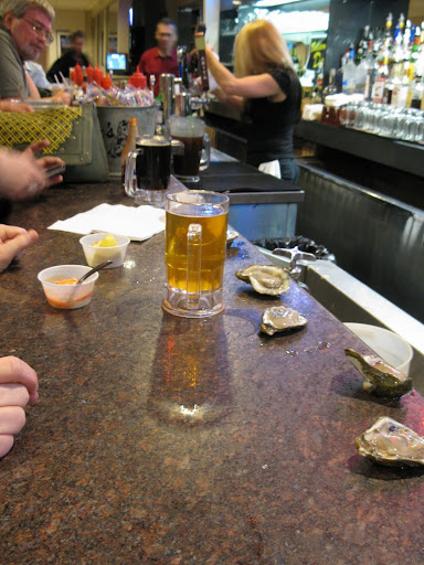 It was a perfect late lunch: plastic mugs of beer, oysters plopped right on the counter, and a setup to make your own cocktail sauce.
